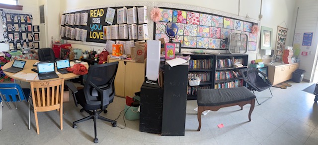 Student writing assignments displayed in the classroom