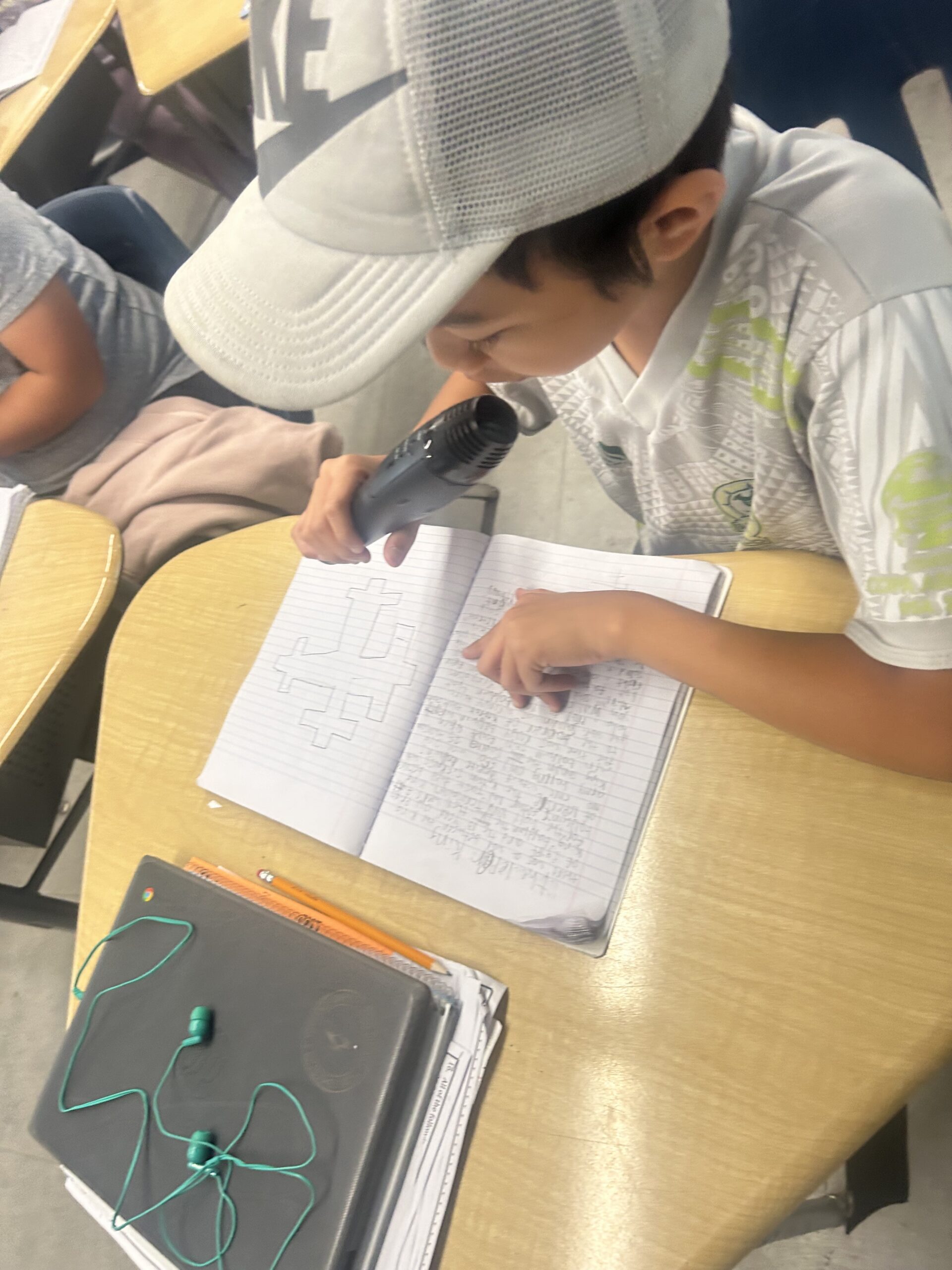 Student reading from a journal with microphone for CSTP 1 Evidence 2